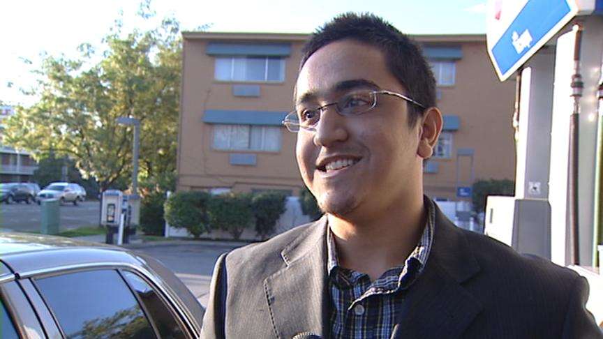 Ali Farknar, a professional driver, saved a few dollars at the pump thanks to lower gas prices.