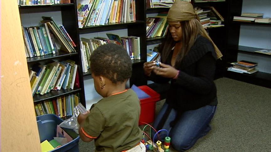 Alexzandria Parker plays with her son at the Road Home shelter