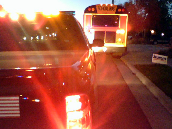 Car and school bus collide