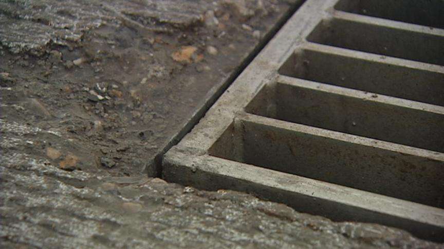 15 cars damaged after grate pulled out of road