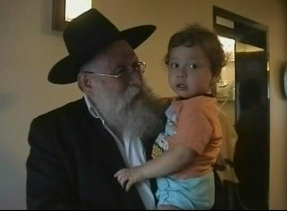Rabbi Gavriel Holtzberg's son Moshele reunited with grandfather.