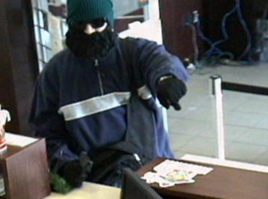 Surveillance photo of "Bearded Bandit" robbing a Key Bank in South Jordan.