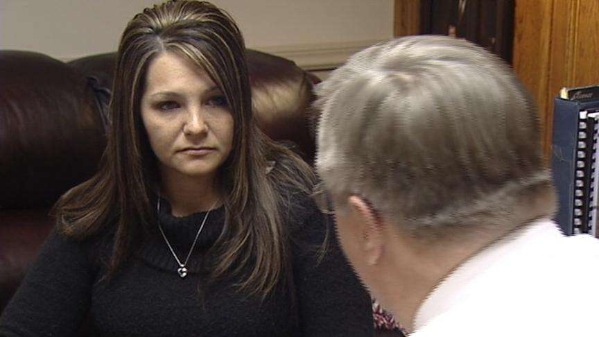 Natasha Child speaking with an attorney.