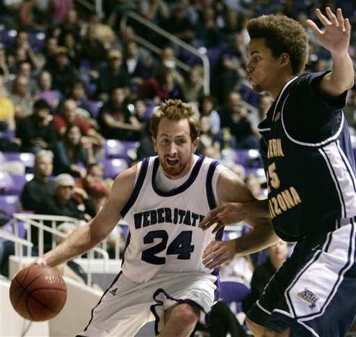 Weber State forward David Patten (24) heads to the basket past Northern Arizona forward Ryan McCurdy during the first half of the Big Sky college basketball tournament championship game Wednesday, March 7, 2007, in Ogden, Utah. (AP Photo/Douglas C. Pizac)