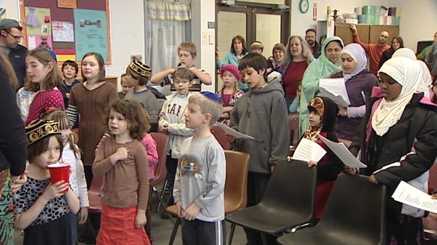 Children sing of bringing peace to the world