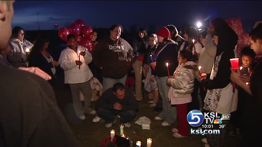 Victim's friends and family gather Saturday night.