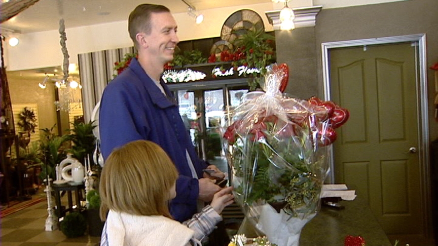 Steve Spring picks up flowers for his girlfriend.