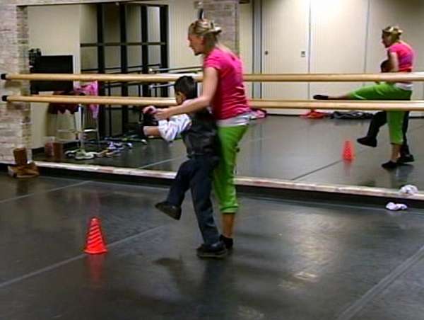 Woman teaching children with disabilities to love dance