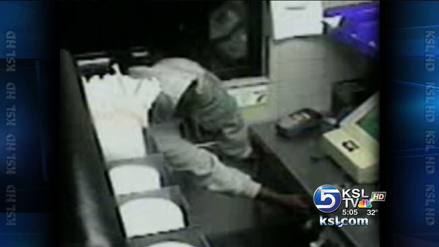 Customer reaches through drive-thru window to rob restaurant