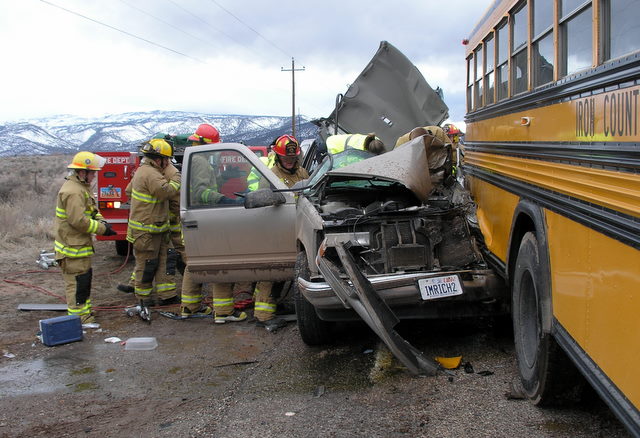 Man dies after crashing truck into school bus