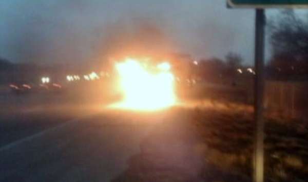 Cell phone picture of Butler's car on fire