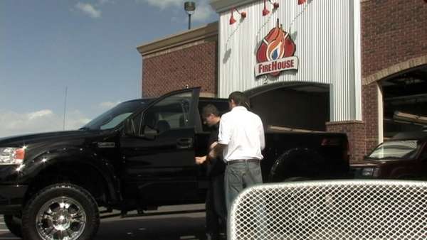 ‘FireHouse' employee saves woman from burning car