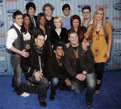 The 13 finalists of "American Idol" pose together at the American Idol Top 13 Party in Los Angeles, Thursday, March 5, 2009. Kneeling from left to right are Matt Giraud, Jorge Nunez and Michael Sarver. Standing from left to right are Kris Allen, Jasmine Murray, Adam Lambert, Lil Rounds, Alexis Grace, Anoop Desai, Allison Iraheta, Danny Gokey and Megan Corkrey. (AP Photo/Chris Pizzello)